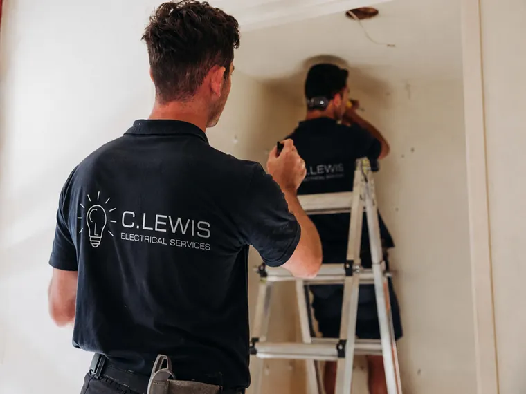 Two C.Lewis electricians running new cabling during a home renovation in the Sutherland Shire